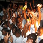canouan_children_singing_on_stage_with_anita