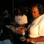 principal_canouan_government_school_assisting_in_sharing_snacks